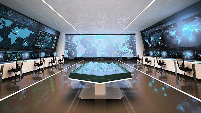 Sala con varias pantallas gigantes que cubren las paredes y muestran sofisticados mapas digitales