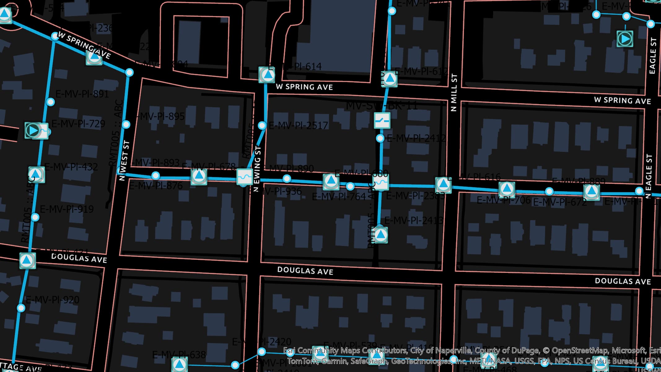 A black map with connected blue lines and red roads representing water pipes and valves in a residential neighborhood