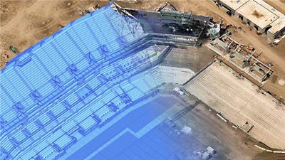 3D CAD drawing fading into a 3D mesh, demonstrating how ArcGIS can combine drone and other data